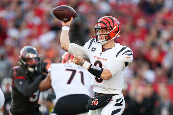 Dec 18, 2022; Tampa, Florida, USA; Cincinnati Bengals quarterback Joe Burrow (9) drops bay to pass against the Tampa Bay Buccaneers in the first quarter at Raymond James Stadium. Mandatory Credit: Nathan Ray Seebeck-USA TODAY Sports